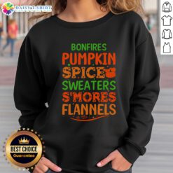 Cozy bonfires with pumpkin spice, flannels, and sweatshirts, perfect for enjoying s'mores on a crisp autumn evening.