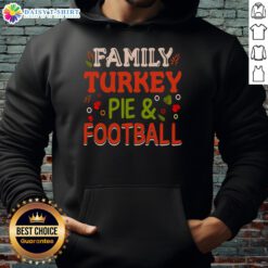 Family enjoying a turkey pie while wearing a cozy football hoodie, perfect for festive gatherings and holiday celebrations.