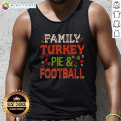 Happy family enjoying turkey pie while wearing football tank tops, celebrating togetherness and delicious food.