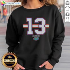 Jadan Baugh wearing a Florida Gators football sweatshirt, number 13, showcasing team pride and style.