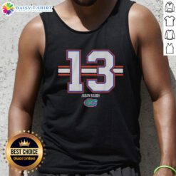Alt Text: Jadan Baugh wearing a Florida Gators football stripe tank top, showcasing number 13 in vibrant team colors.