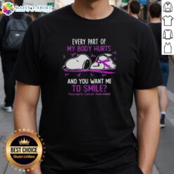 Snoopy graphic on a t-shirt with text about pain and smiling for pancreatic cancer awareness.