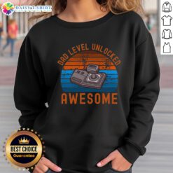 Original Dad Level Unlocked Retro Gamer Sunset Sweatshirt featuring a vibrant sunset and classic gaming graphics.