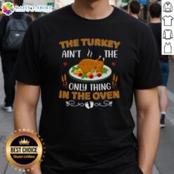 Alt Text: Original The Turkey Ain't The Only Thing In The Oven T-Shirt featuring a humorous Thanksgiving design.