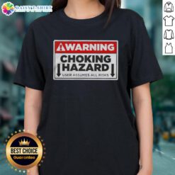 Funny warning label on a ladies tee, highlighting choking hazard and user assumes all risks, perfect for humorous apparel.