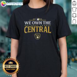 Ladies tee celebrating the Milwaukee Brewers 2025 American League Central Division Champions, featuring 'We Own The AL Central' design.