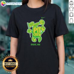 Good Sco Ducks Pit Crew women wearing team tees in Eugene, Oregon, showcasing team spirit and camaraderie.