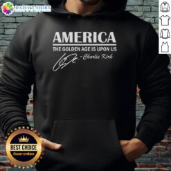 Charlie Kirk wearing a 'Hot America: The Golden Age Is Upon Us' hoodie, promoting patriotic themes and American pride.