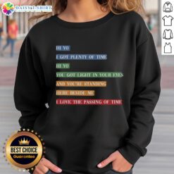 Colorful retro sweatshirt featuring vibrant song lyrics about time passing, perfect for music lovers and vintage fashion fans.