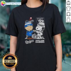 Hot Snoopy and Charlie Brown in Dodgers and Raiders skyline design on a stylish ladies tee shirt.