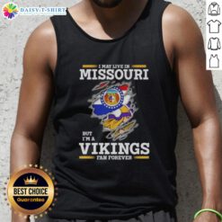 Official I May Live In Missouri But I'm A Minnesota Vikings Fan Forever tank top featuring bold Vikings logo design.