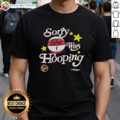 Official Sorry She Was Hooping Indiana Fever 2025 WNBA Playoffs T-Shirt featuring team colors and logo.