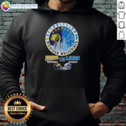 Premium Michigan Wolverines hoodie featuring helmets and Detroit Lions skyline, perfect for game days and fan style.