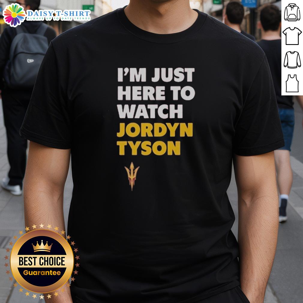 Alt Text: Top Jordyn Tyson I'M Just Here To Watch T-Shirt featuring bold graphics and casual style for fans and everyday wear.