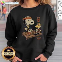 Cozy Top Snoopy Woodstock Sushi Tomodachi Club sweatshirt featuring colorful characters, perfect for fans and casual wear.