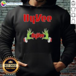 Awesome Grinch hands on a festive Hy-Vee Christmas hoodie, perfect for holiday cheer and seasonal celebrations.