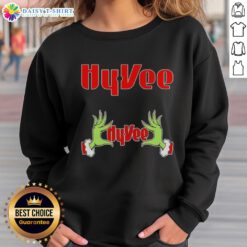 Alt Text: Awesome Grinch hands on a festive Hy-Vee Christmas sweatshirt, perfect for holiday celebrations and cozy winter wear.