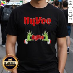 Alt Text: Awesome Grinch hands holding a heart on a Hyvee Christmas T-Shirt, perfect for festive holiday celebrations.