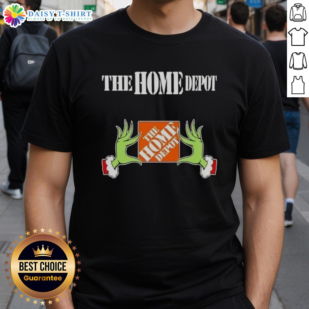 Awesome Grinch hands holding a Christmas ornament on a Home Depot T-Shirt, perfect for holiday festivities and gifts.
