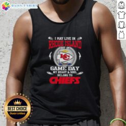 Cheerful fan wearing a Kansas City Chiefs tank top, showcasing pride while living in Rhode Island on game day.