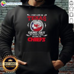Person wearing a Kansas City Chiefs hoodie, showcasing team pride on game day, despite living in Texas.