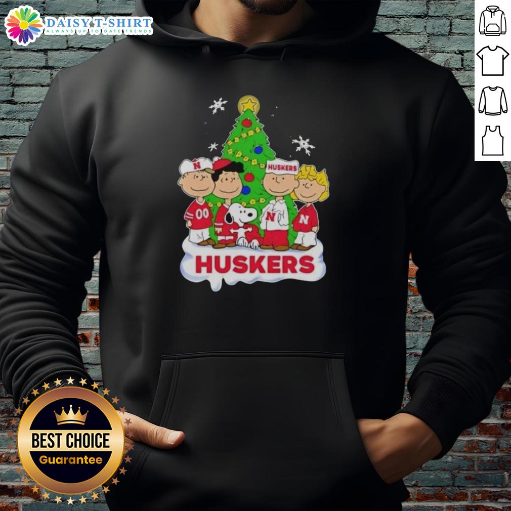 Awesome Peanuts characters Christmas hoodie featuring Nebraska Cornhuskers logo, perfect for festive fans.