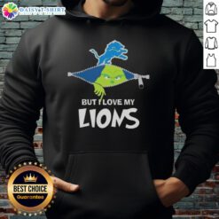 Cute Grinch wearing a Detroit Lions football hoodie, showcasing holiday spirit and team pride in a festive setting.