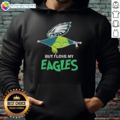 Cute Grinch wearing a Philadelphia Eagles hoodie, showcasing team spirit and holiday cheer in a fun, festive style.