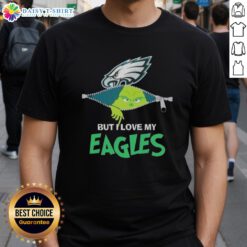 Cute Grinch wearing a Philadelphia Eagles football T-shirt, showcasing holiday spirit and team pride.