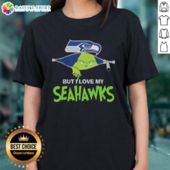 Alt Text: Cute Grinch graphic on a Seattle Seahawks football ladies tee, perfect for fans celebrating the holiday season.