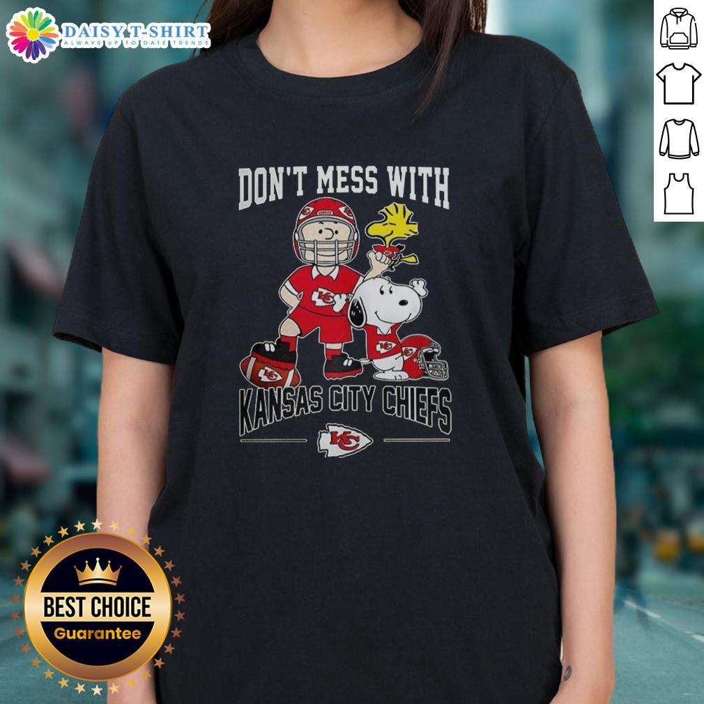 Alt Text: Cute Snoopy and Charlie Brown Peanuts graphic on a ladies tee, celebrating Kansas City Chiefs football spirit.