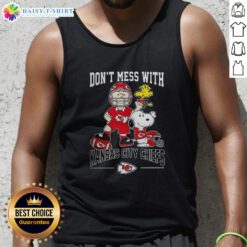 Alt Text: Cute Snoopy and Charlie Brown Peanuts tank top featuring Kansas City Chiefs football design for fans.