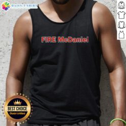 Mike McDaniel wearing a stylish 'Good Fire' tank top, showcasing his trendy sports fashion and vibrant personality.