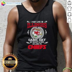 Cheerful fan wearing a Kansas City Chiefs tank top, showcasing team spirit while living in Illinois on game day.