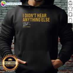 Brice Turang wearing a Milwaukee Brewers hoodie with 'I Didn't Hear Anything Else' graphic at a game.