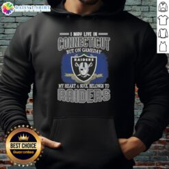 Connecticut fan wearing a Raiders hoodie, showcasing loyalty on game day with team pride and spirit.
