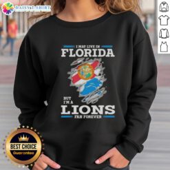 Florida sweatshirt featuring 'I May Live In Florida But I'm A Lions Fan Forever' design, perfect for Detroit Lions fans.