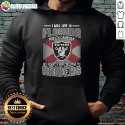 Person wearing a Raiders hoodie with text 'I May Live In Florida But On Gameday My Heart Belongs To Raiders'.
