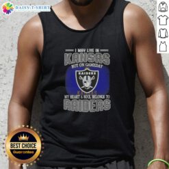 Stylish tank top reading 'I May Live In Kansas, But On Gameday My Heart Belongs To Raiders' for fans.