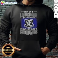 Alt Text: Person wearing a Raiders hoodie, showing team spirit in Louisiana on game day, heart and soul with the Raiders.