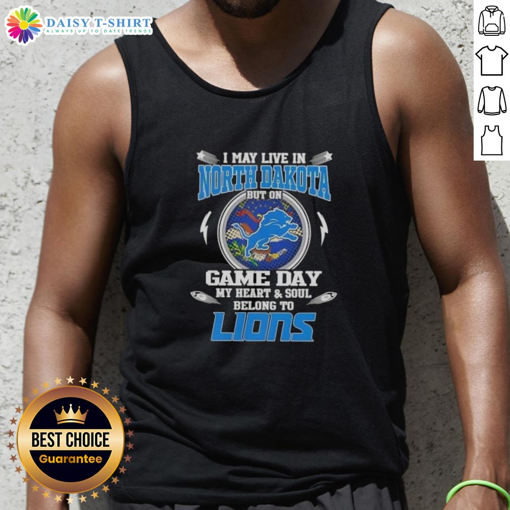 Alt Text: Woman wearing Detroit Lions tank top, showcasing team spirit on game day in North Dakota.