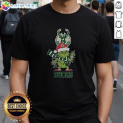 Milwaukee Bucks Christmas Grinch Santa Hat T-Shirt for Holiday 2025, featuring festive graphics and team colors.
