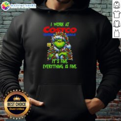 Alt Text: Cozy Official Grinch Christmas Tree hoodie from Costco Wholesale, featuring the phrase I work at it's fine, everything is fine.