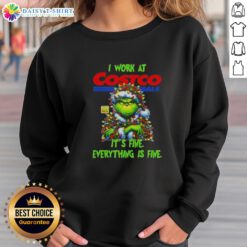 Alt Text: Official Grinch Christmas Tree sweatshirt from Costco Wholesale featuring the phrase 'I Work At It's Fine Everything Is Fine'.