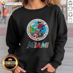 Alt Text: Official Miami All Sports sweatshirt featuring logos of Dolphins, Heat, Marlins, Miami FC, Panthers, and Hurricanes.