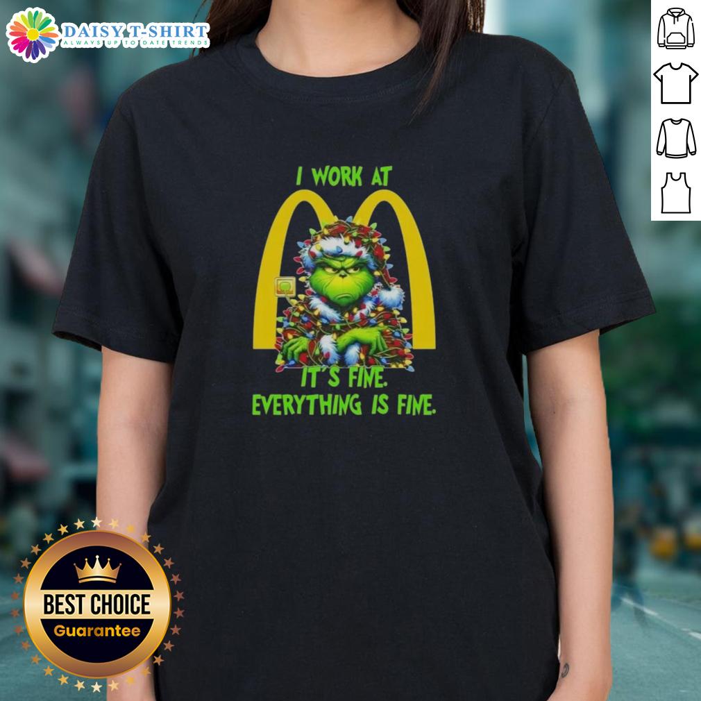 Premium Grinch Christmas Tree tee featuring 'I work at McDonald's, it's fine' for festive holiday style.