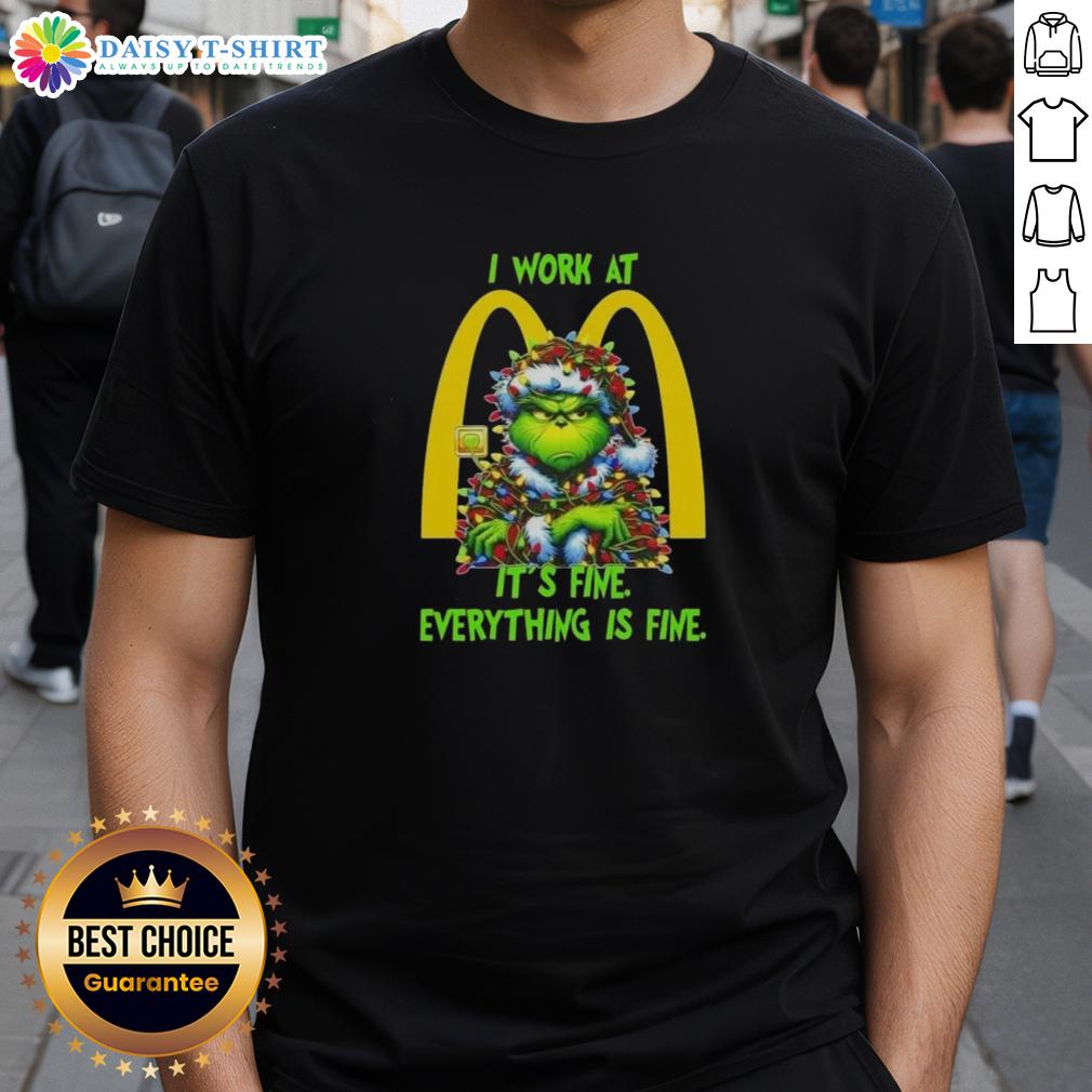 Alt Text: Premium Grinch Christmas Tree X McDonald's t-shirt design featuring I Work At It's Fine Everything Is Fine slogan.
