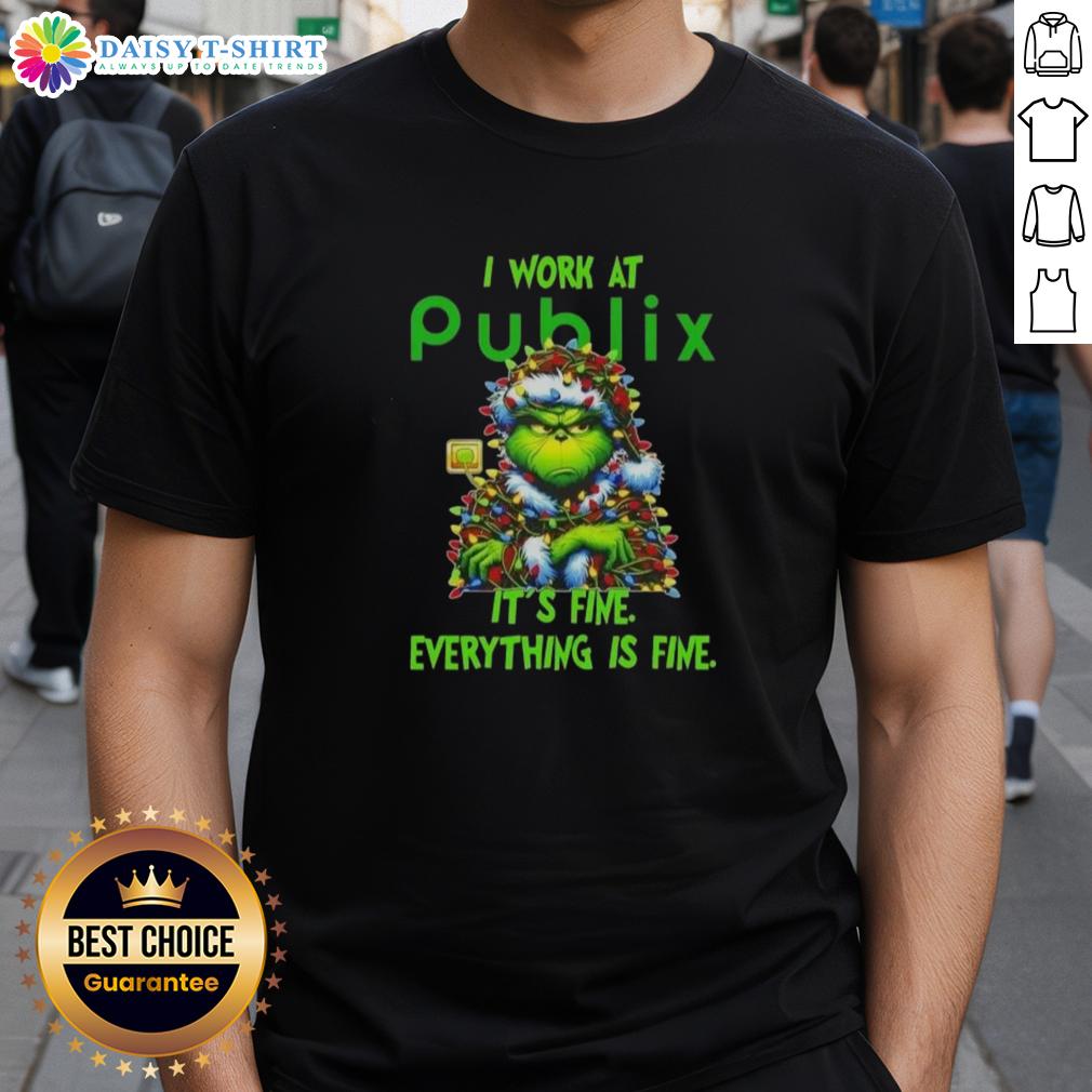 Premium Grinch Christmas Tree T-Shirt featuring 'I Work At It's Fine Everything Is Fine' slogan, perfect for festive cheer.