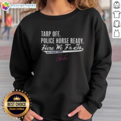 Alt Text: George Springer in a Toronto Blue Jays sweatshirt celebrates as a police horse stands nearby during 2025 Division Champs event.
