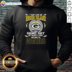 Person wearing a Green Bay Packers hoodie, showcasing team spirit while living in Rhode Island on game day.